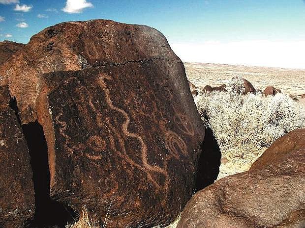 A petroglyph rock faces the trail at Grimes Point.
