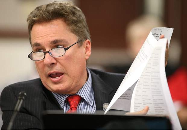 Nevada Assemblyman Brent Jones, R-Las Vegas, presents a measure in committee that would repeal Common Core K-12 education standards during a hearing at the Legislative Building in Carson City, Nev., on Wednesday, April 1, 2015. (AP Photo/Cathleen Allison)