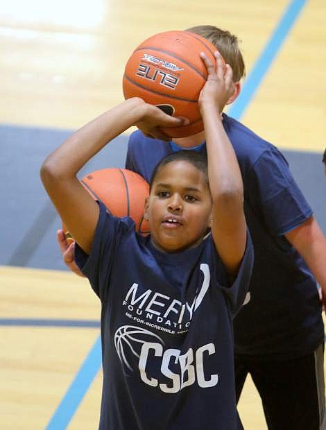 DeCarlo Quintana, 11, attends a basketball camp on Tuesday sponsored by the MeFiYi Foundation and Carson High School basketball.