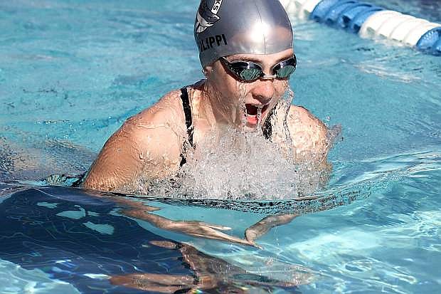 Victoria Defilippi, 13, swims the breaststroke at the High Country Championships in Minden.