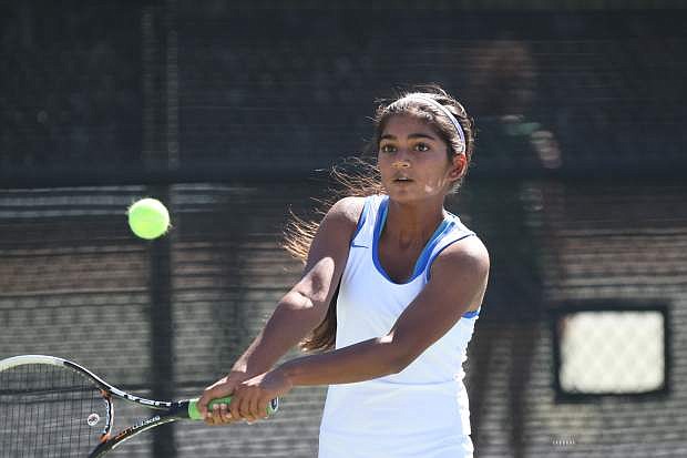 Number one singles player Preeta Amin returns a volley in her match against Damonte Ranch on Tuesday.