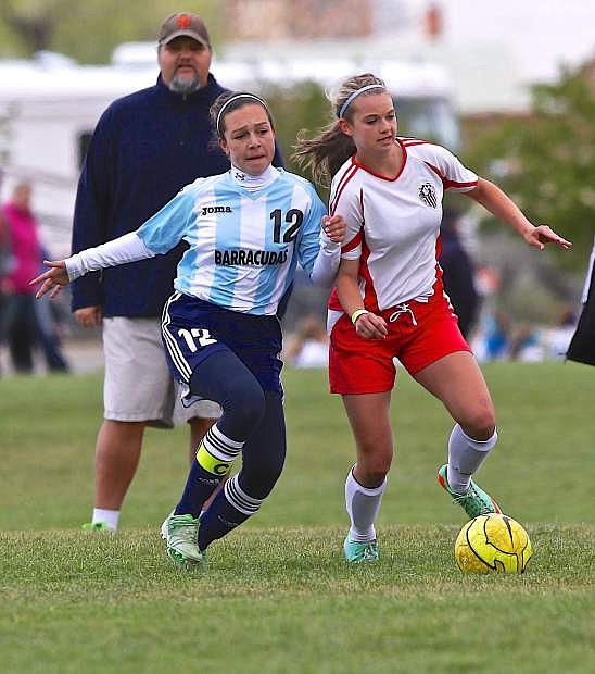 CV United&#039;s Sedona Robinson pushes the ball upfield as Pacifica&#039;s Sydney Burnham defends Saturday at the Comstock Shootout.