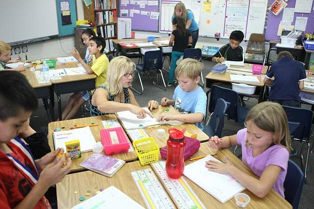 Bonnie Benson&#039;s second-grade class at Fritsch Elementary School learn about graphing on Friday.