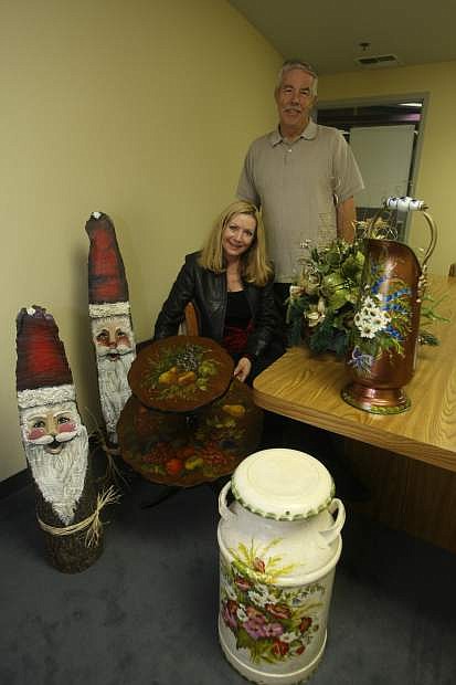 Sigrid and Ron Hobbs with artwork that will be available at the Carson High School craft fair.