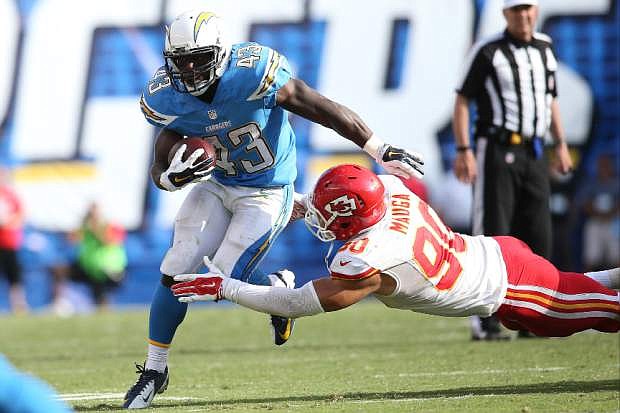San Diego Chargers running back Branden Oliver #43 and Kansas City Chiefs inside linebacker Josh Mauga #90 during an NFL game played at Qualcomm Stadium in San Diego on Sunday Oct. 19, 2014. (AP Photo/Michael Zito)