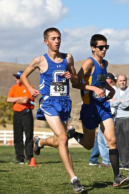 Carson&#039;s Ian Van Rensselaer rounds a turn with a Reed runner at the regional cross country event at Rancho San Rafael Park last year.