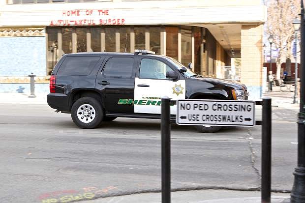 A Sheriff&#039;s vehicle drives over the painted-over crosswalk in front of Cactus Jack&#039;s on Carson Street Wednesday.