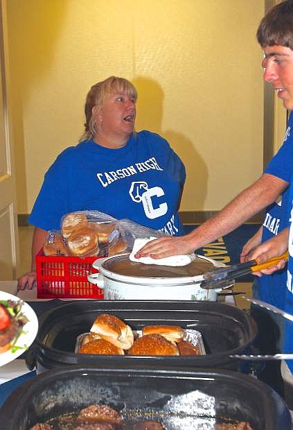 CHS Culinary Arts instructor Penny Reynolds organizes her serving line Friday evening at the Governor&#039;s Mansion in Carson City.
