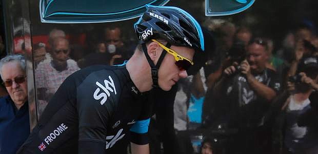 Overall leader Christopher Froome of Britain leaves for a training on the rest day of the Tour de France cycling race in Orange, southern France, Monday July 15, 2013. (AP Photo/Laurent Cipriani)