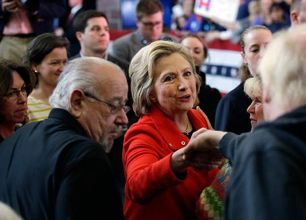 Democratic presidential candidate Hillary Clinton, center, shakes hands with supporters after speaking at a rally at Truckee Meadows Community College on Monday, Feb. 15, 2016, in Reno, Nev. (AP Photo/Marcio Jose Sanchez)