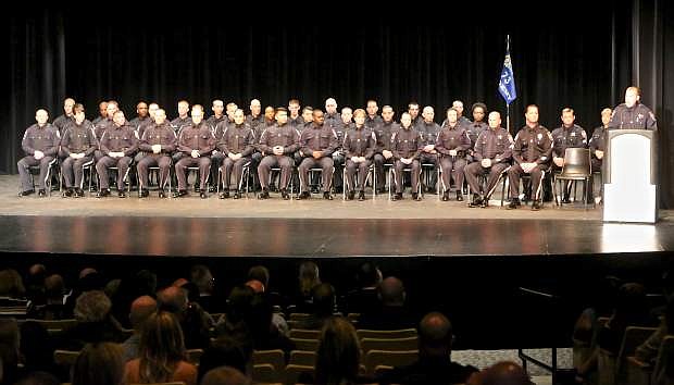 Nevada Dept. of Public Safety Category 1 Basic Academy 73 is seated on the stage at the community center during commencement Friday.