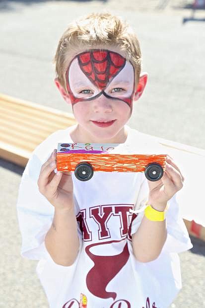Spiderman, aka Kale Rose, 5, displays his Pinewood Derby car Saturday at Dayton Valley Days.