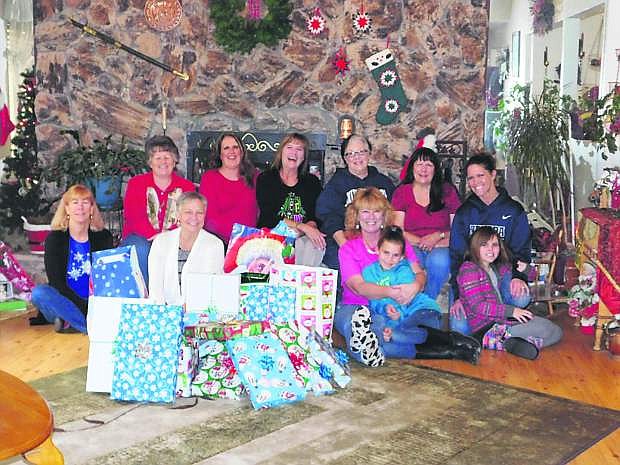 Dicey Dames, a Dayton Bunko group, held its annual wrapping party for a family it adopted for Christmas. Each year the group adopts a family to shop for and donate presents. It also provides food for Christmas dinner.