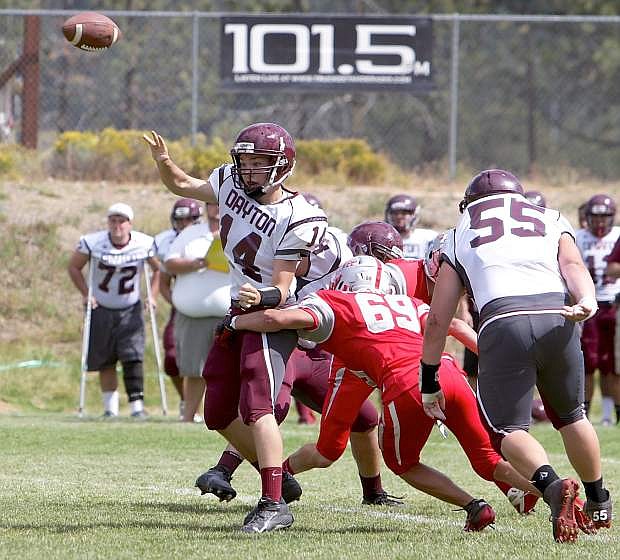 Dayton&#039;s Davis Winebarger makes a pass as the Truckee defense closes in during Saturday&#039;s game.
