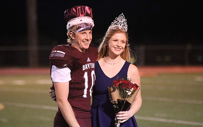 Seniors Blake Fletcher, left, and Makenna Olsen are named homecoming king and queen during halftime of Dayton High School&#039;s  game Friday.