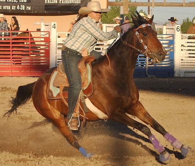 Kelly Quillan picks up speed in the barrel races, one of the most popular attractions of  the third annual DeGolyer Buckin&#039; Horse and Bull Bash.