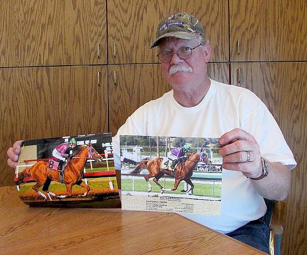 Steve Coburn displays photos of California Chrome, the early favorite to win at the Kentucky Derby on May 3.