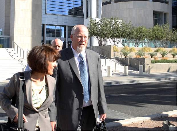 File-This April 3, 2013 file photo shows one-time political powerbroker Harvey Whittemore leaving the Lloyd George Federal Courthouse in Las Vegas. A Nevada State Bar panel has 30 days to recommend whether lawyer, developer and former political powerbroker, Whittemore should keep his law license or be suspended or disbarred. Disciplinary hearings ended Wednesday Jan. 22, 2014 in Reno, and it&#039;ll be up to the Nevada Supreme Court to take the State Bar recommendation and make a final decision on Whittemore&#039;s future. (AP Photo//Las Vegas Review-Journal, Jerry Henkel,File)
