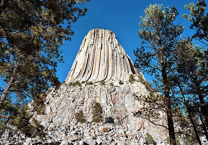 FILE - This undated file photo shows Devils Tower near Moorcraft, in northeastern Wyoming. As the nation&#039;s first national monument approaches its 110th anniversary in 2016, some American Indian tribes are seeking to change the name of the geologic feature to Bear Lodge and the name of the monument to Bear Lodge National Monument, because they view the name as unbefitting for a monument they consider to be a sacred site. Opponents of the idea say changing the name would cause confusion and hurt tourism. (Stephen Berend/Gillette News Record via AP, File)