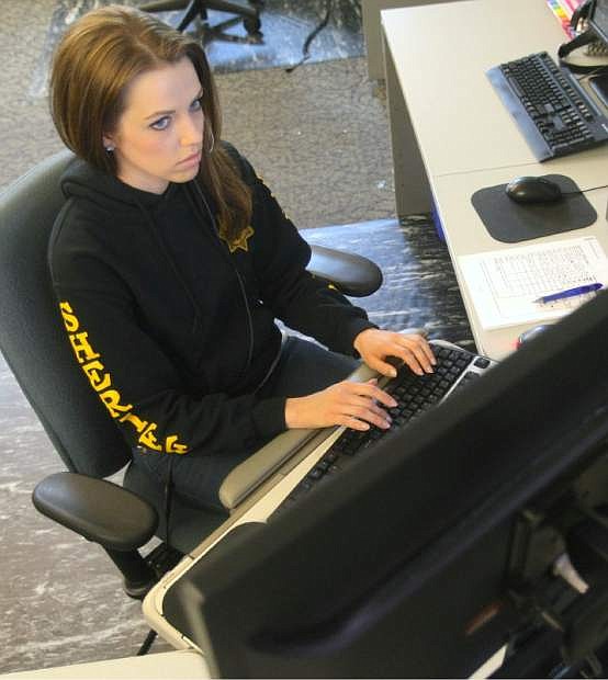 Carson City Sheriff&#039;&#039;s dispatcher Kathryn Burgess keeps in contact with deputies during a call on Tuesday.