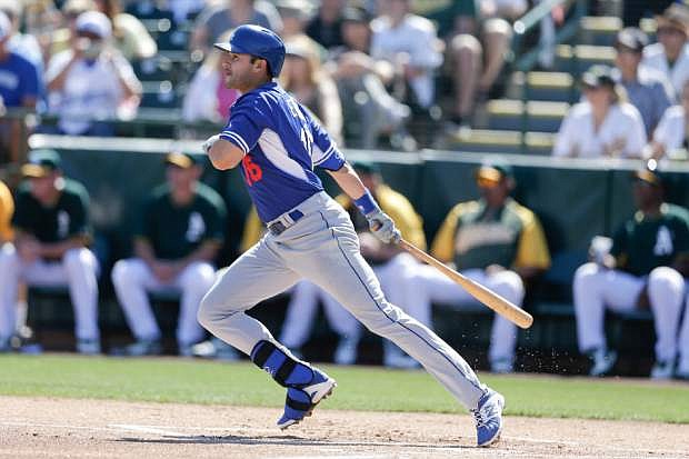 Los Angeles Dodgers&#039; Andre Ethier watches his hit for a single against the Oakland Athletics during the first inning of a spring training baseball game Monday, March 3, 2014, in Phoenix. (AP Photo/Gregory Bull)
