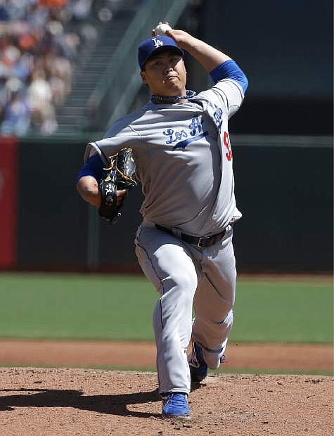 Los Angeles Dodgers pitcher Hyun-jin Ryu, from South Korea, throws against the San Francisco Giants during the first inning of a baseball game in San Francisco, Thursday, April 17, 2014. (AP Photo/Jeff Chiu)