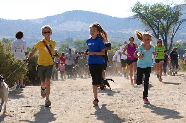 Runners and walkers and their dogs start the CASI 5k/2k Run-Walk Saturday morning at Riverview Park in Carson City.