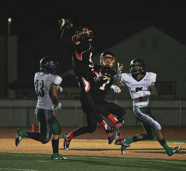 Douglas&#039; Tre Jackson (5) intercepts a pass in a loss to Damonte Ranch Thursday night in Minden.