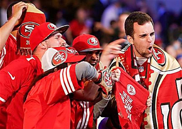 San Francisco 49ers fans cheer during the second round of the 2014 NFL Draft, Friday, May 9, 2014, in New York. (AP Photo/Jason DeCrow)