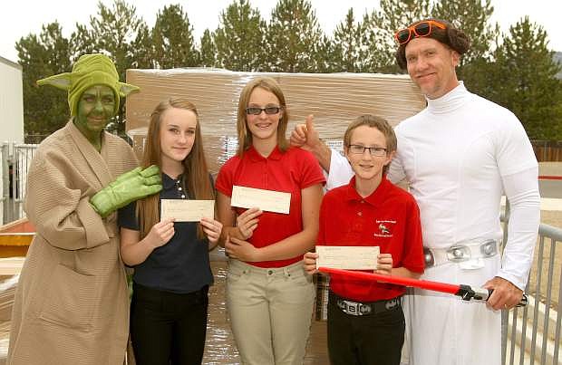 Eagle Valley Middle School principal Lee &quot;Princess Leia&quot; Conley and vice-principal Dr. Susan &quot;Yoda&quot; Moulden congratulate students, from left, April Tedrowe, Anika Soulier and Jeremy Parman for raising the most money for the school&#039;s annual cookie dough fundraising event.