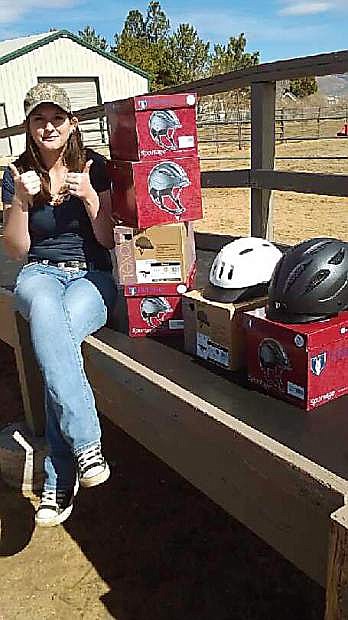 As part of her senior project at Carson High School, Briana Mueller collected helmets for the Sierra Therapeutic Equestrian Program. Over the last five months she has raised $500 for the riding program through recruiting members; $300 was used to purchase helmets and the remainder will be used for scholarships to the nonprofit program.