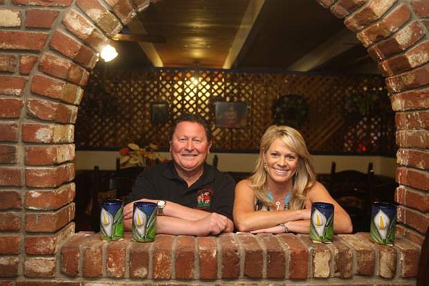 El Charro Avitia owners Avel and Michelle Avitia pose for a picture inside their restaurant that has been in business at the same location for more than 30 years.