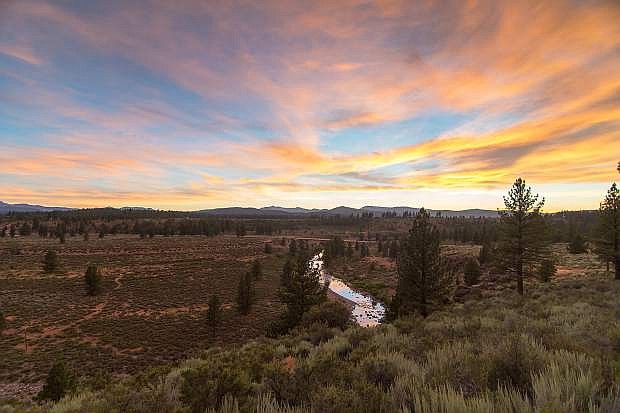 The sun sets above the Truckee River Legacy Trail in Glenshire on June 30. The impacts of the current California drought can be seen, as the stream&#039;s flow is much less fulfilling than years past.