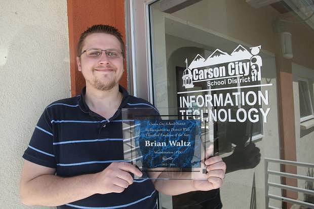 Brian Waltz displays his Carson City School District Cassified Employee of the Year award.
