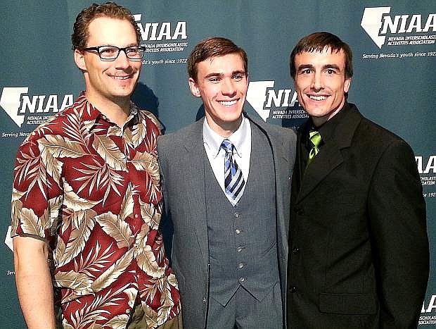 Churchill County High School senior Erik Endacott, center, celebrates being honored as one of the Nevada Interscholastic Activities Association&#039;s Top 10 Northern Student-Athletes in 2014. With Endacott are CCHS teacher and coach Keith Sluyter, left, and former cross-country coach Mitch Overlie.