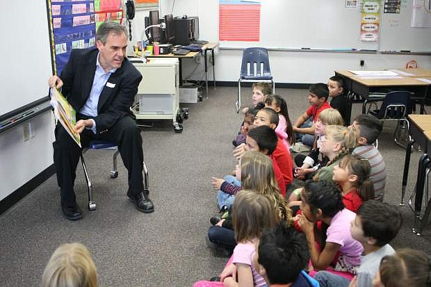 Dale Erquiaga, former Nevada superintendent of public instruction, reads  to first-graders in 2013.