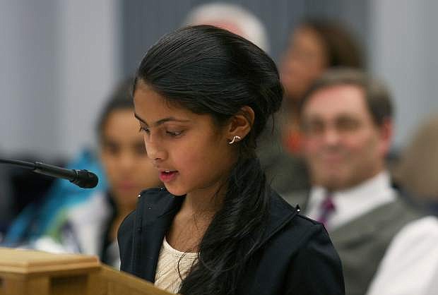 Vidhi Pandit, a Bordewich-Bray fifth-grader, reads her winning essay during the Carson City Board of Supervisors meeting Tuesday.