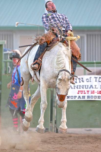 Danny Pacheco of Douglas County competes in the ranch bronc event Friday night at Fuji Park.