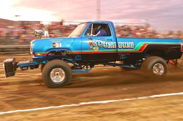 Larry Lopes of Oakdale, Ca. drives his Dodge Power Wagon &#039;Young Guns&#039; down the fairground track Saturday night in Carson City.