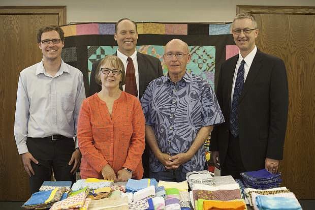 Steve Mulvenon and Gina Session, executive board members of the Northern Nevada International Center, attended the quilt showcase. From right to left, President Doug Peterson of the Carson City Nevada Stake, Steve Mulvenon and Gina Session of the Northern Nevada International Center, Curtis Palmer and Scott Jones of the Carson City Nevada Public Affairs Committee.