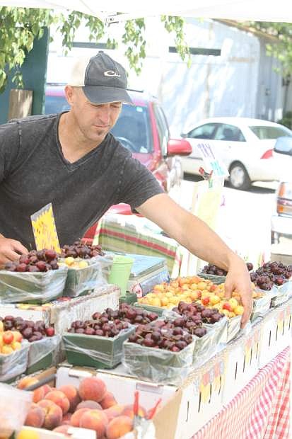 Matt Minton of Minton&#039;s Farm Fresh Produce in Yuba City, Calif., arranges cherries last year.