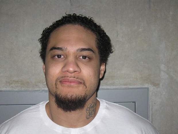 This Feburary 2012 photo, provided by the Utah Department of Corrections, shows Siale Angilau. A U.S. marshal shot and critically wounded Angilau on Monday, April 21, 2014, in a new federal courthouse after he rushed the witness stand with a pen at his trial in Salt Lake City, authorities said. Angilau was one of 17 people named in a 29-count racketeering indictment filed in 2008 accusing gang members of conspiracy, assault, robbery and weapons offenses. (AP Photo/Utah Department of Corrections)