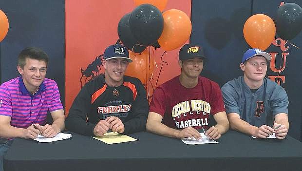 From left are Fernley&#039;s Justice Ackerson, Kevin Montgomery, Gavin Henderson and Shane Kelso. Each signed their National Letter of Intent on Tuesday at Fernley High School.