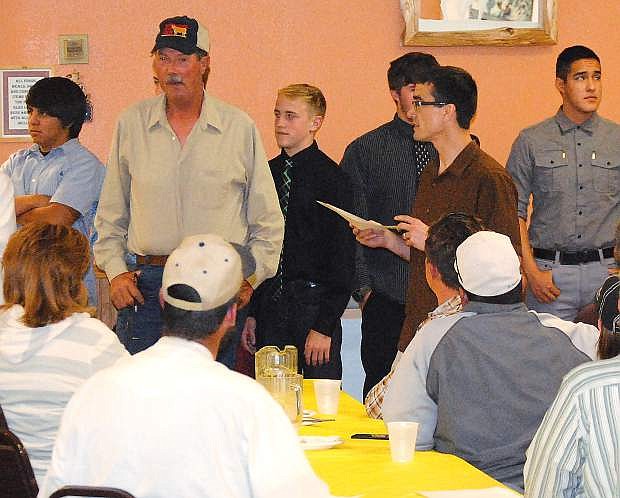 Boxing coach Mitch Overlie, with paper, introduces the boxers as auctioneer Ted Guazzini, in hat, looks on. The Night of Boxing returns tonight at 5 p.m. at the Gym at Venturacci Park.