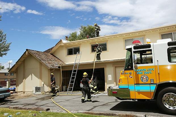 Firemen responded to a fire that damaged two units of an apartment building in Carson City on Friday.
