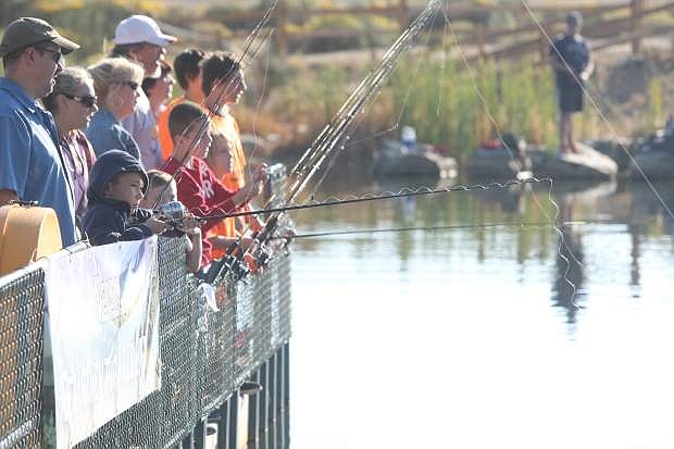 Children fish during the annual Tom Brooks Memorial Kids Fishing Day on Saturday.