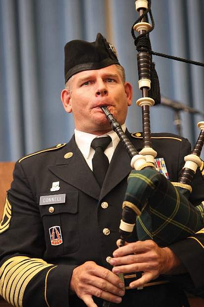 Sgt. First Class Michael Connell plays the bagpipes at the Annual Flag Day ceremony on Friday.