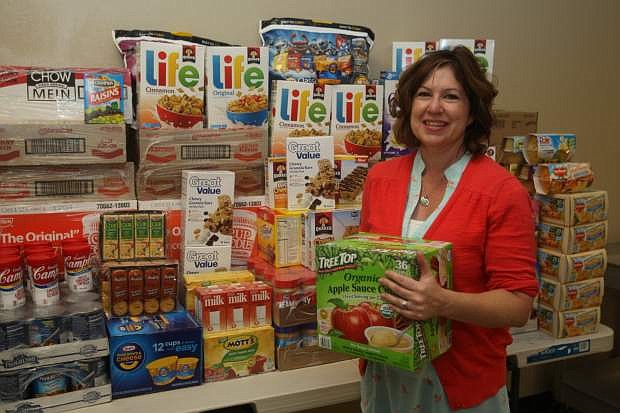 Stephanie Gardner, executive director of Food for Thought stands next to more than 350 lbs. of food donated on Monday and Tuesday.
