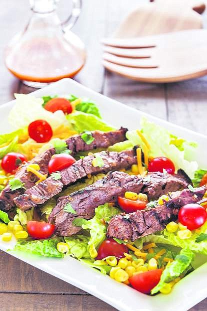 Steak salad with corn and tomatoes
