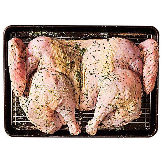 Spatchcocking, removing the back bone, a turkey resembles butterflying, so each half of the bird lays flat while it cooks. The process lends juicier meat and crispier skin.